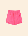 The Declan Short by Xirena features bright pink cotton poplin, an elasticized drawstring waist, two front pockets, and folded hems, shown against a plain light beige background.