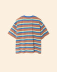 The Paulina Tee by Xirena is a relaxed-fit, short-sleeved striped cotton jersey t-shirt with brown, blue, white, and green horizontal stripes, a contrasting ringer neck, and a left chest pocket. Shown flat on a beige background.