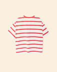 The Paulina Tee by Xirena is a short-sleeved, white cotton jersey t-shirt with horizontal red stripes, shown flat on a beige background. It has a relaxed, boxy fit and a classic crew neckline.