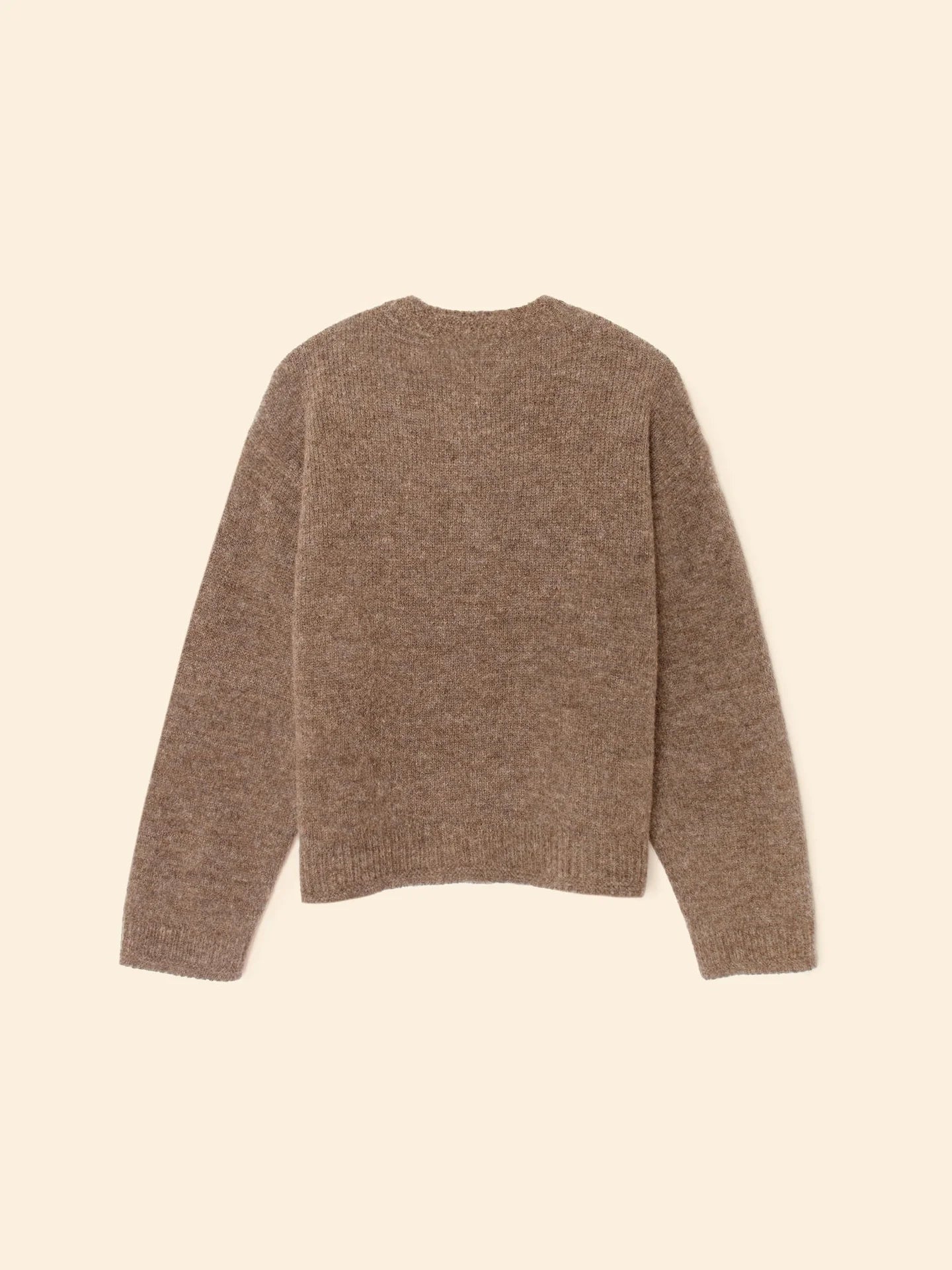 The Cameron Sweater by Xirena, made from soft merino wool, is displayed flat on a neutral background, showing its brown color, long sleeves, and crew neckline from the back.
