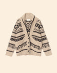 The Xirena Vail Cardigan, a beige alpaca sweater with black geometric and snowflake patterns, shawl collar, front buttons, and two pockets, is displayed flat on a cream background.