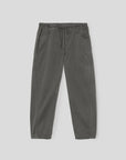 The Xirena Baxter Pant is a pair of loose-fitting, charcoal gray cropped pull-on pants in vintage washed cotton twill with an elastic drawstring waist, shown on a plain light gray background.
