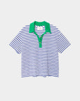 The Xirena Kellie Top is a women's short sleeve polo made from striped cotton jersey with blue and white horizontal stripes, a green collar, and a three-button green placket. Shown on a plain light background.