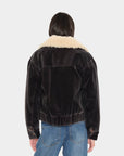 Xirena Bradley Jacket with floral lining and sherpa collar, shown from behind, styled with blue jeans.