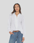 Xirena Amanda lightweight cotton shirt in white with blue jeans, styled casually against a plain background.
