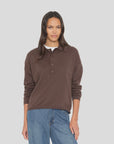 Xirena Collin Sweater in cream paired with blue jeans, shown on model against a light gray background.