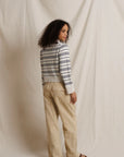 Ximena striped cotton-cashmere sweater by Perfectwhitetee in neutral tones, styled with beige pants, casual look.