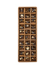 A top view of a rectangular box holds 32 Creative Co-op Mini Glass Star Ornaments, each uniquely assorted in gold and bronze—adding an elegant touch to your Christmas tree décor.