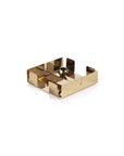 The Zodax IN-8190 Cocktail Napkin Holder Gold features a modern geometric design in gold-tone steel with a central weighted ball on a flat base, stylishly showcased against a white background.