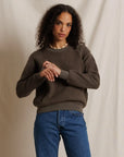 Perfectwhitetee Ziggy Reverse LS Sweatshirt in dark olive, worn by a woman standing before a beige curtain.
