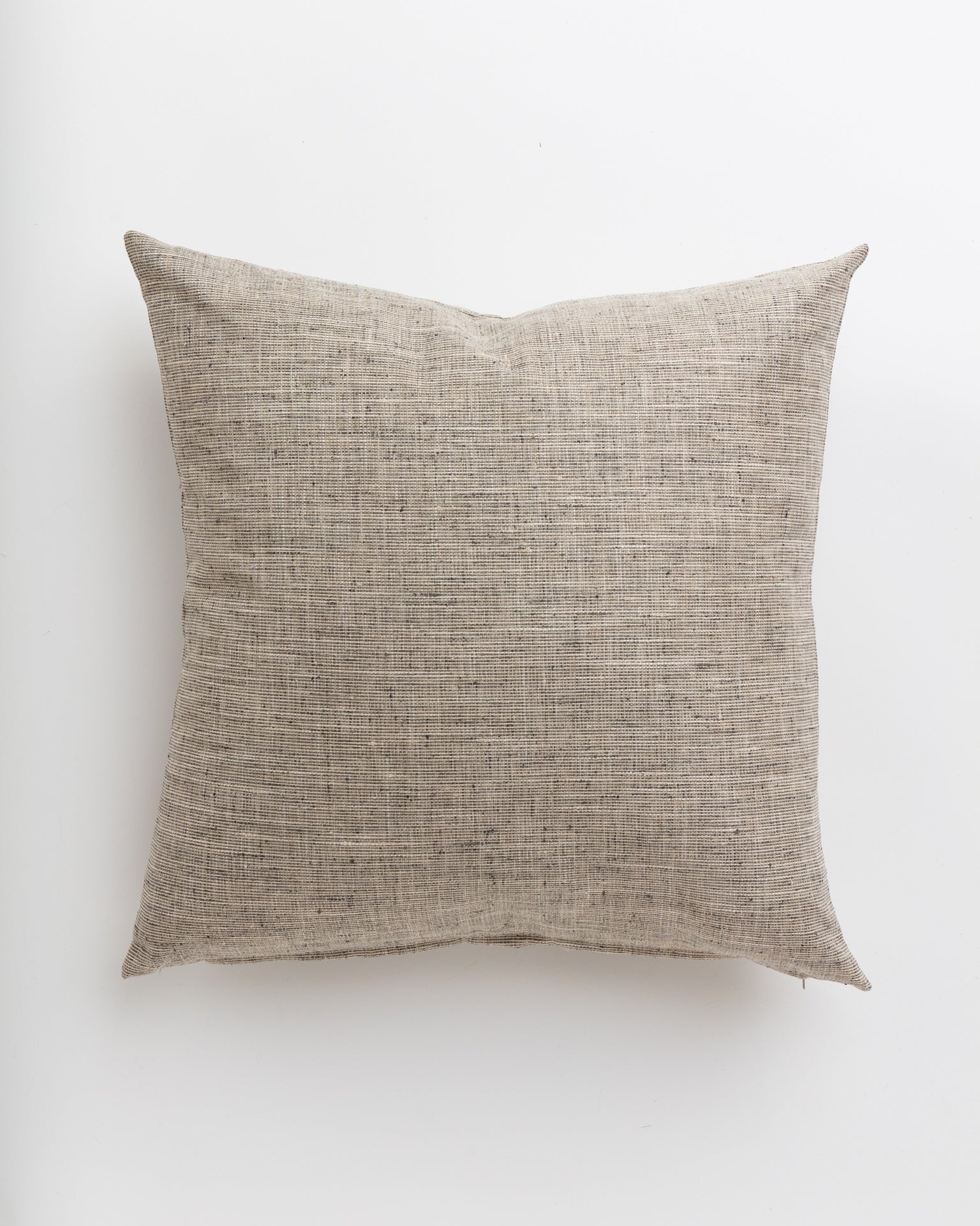 A simple Grasscloth Steel 24x24" throw pillow by Gabby, designed for a Scottsdale bungalow, lying flat against a white background. The texture of the fabric is prominently visible, highlighting its natural, coarse weave.