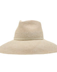 A cream-colored Ninakuru Ember hat with a wide brim and a subtle beige ribbon around the crown, crafted from artisanal semi-fine Toquilla straw, isolated on a white background.