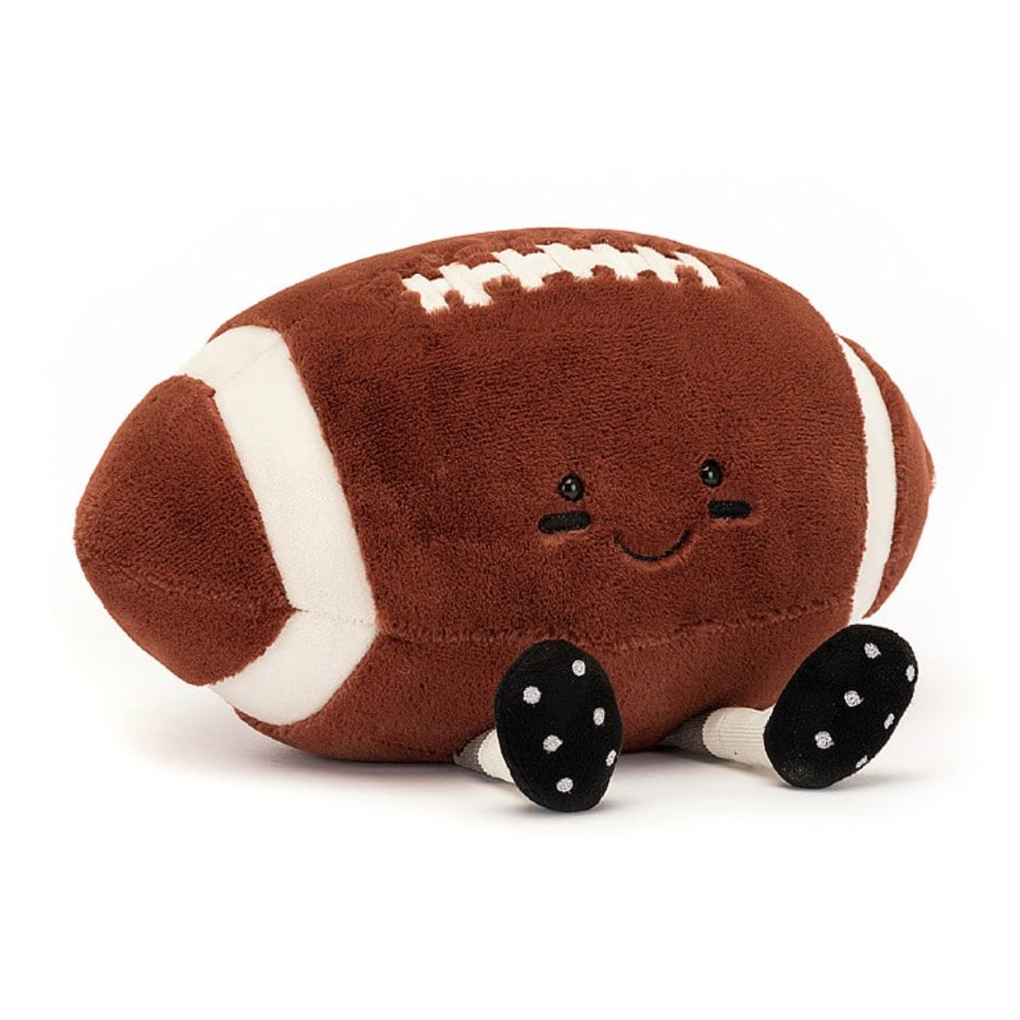 A plush toy styled like a smiling Amuseable Football with white stitching details and small, round black feet on a white background, from Jelly Cat Inc.