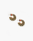Black checkered enamel hoop earrings with gold and red accents by Clare Vivier, perfect for sensitive ears.