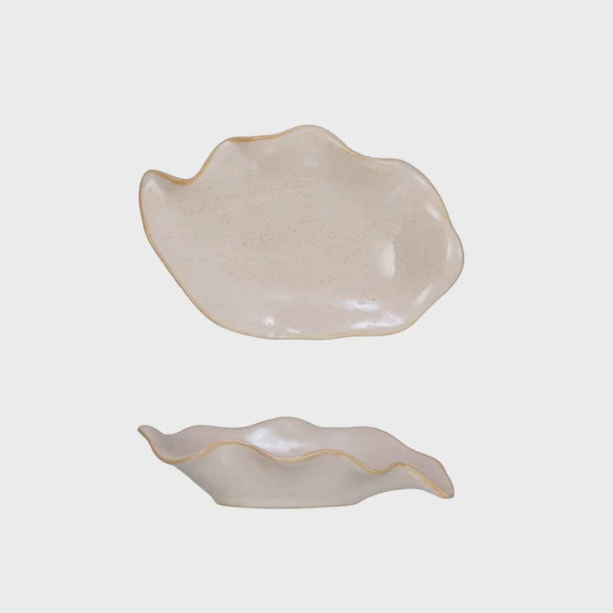 Two Bloomingville Organic Shaped Soap Dishes in a soft beige color, reminiscent of a Scottsdale bungalow, displayed against a white background; one is rounder and the other is elongated.