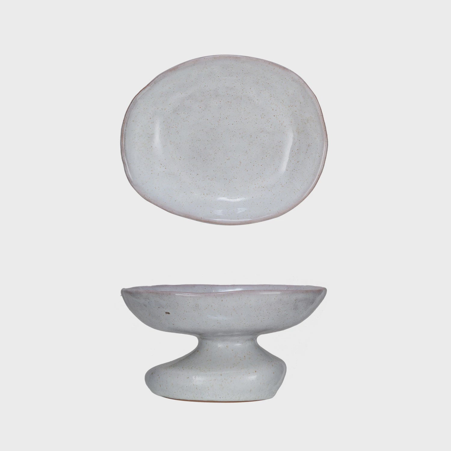 A simple speckled grey ceramic plate at the top and a matching pedestal bowl beneath, featuring a Bungalow style, displayed against a white background.