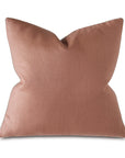 The Castle Linen Rose by Eastern Accents is a square decorative cushion in blush pink with a smooth, soft texture and slightly pointed top corners, shown against a plain white background.