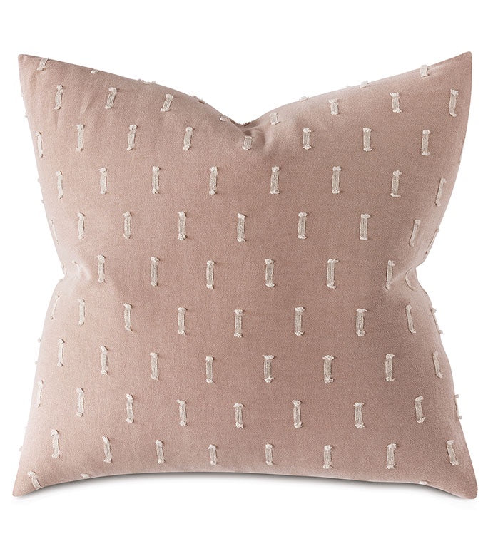 A pink Eastern Accents decorative pillow featuring the Bluff Euro 27x27" design, with a minimalist pattern of white vertical line designs, styled in a square and slightly plush in appearance.