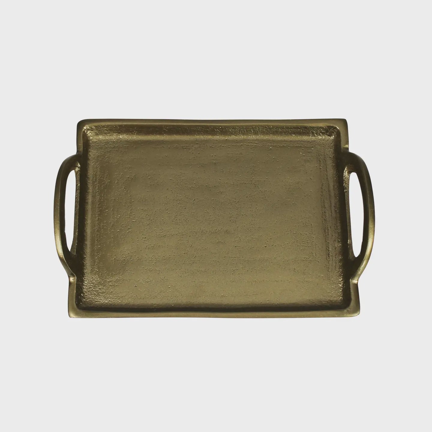 The HomArt Fitz Tray Handles Brass is a rectangular tray with two handles and a textured surface. Its simple and elegant design embodies contemporary style, making it ideal for serving or decorative uses against a plain white background.