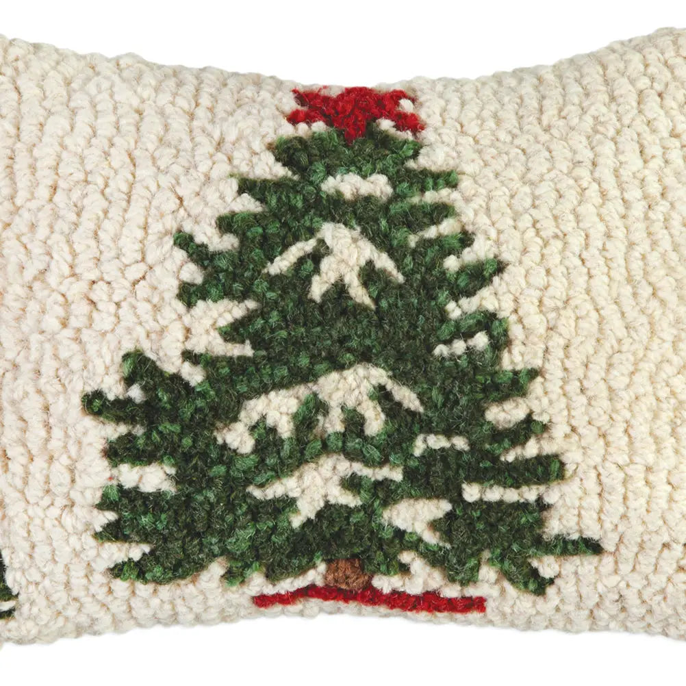 The Faire Christmas Mini Pillows are rectangular, cream-colored hand-hooked pillows featuring a green Christmas tree with snowy white accents and a red topper.