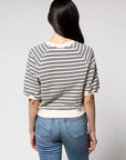 A person with long dark hair stands with their back to the camera against a plain light background, wearing the Perfectwhitetee French Terry SS Raglan Sweatshirt in white and navy stripes with blue jeans.