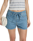 A person wears Rag & Bone uftwt nolan shorts with a drawstring waist, a sleeveless textured top, and holds a woven white clutch. The photo is cropped to show only their torso and upper legs.