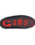 The black sole of Faire's Coma Toes slide slippers displays "Coma" in large, bold red letters with small red circles and a registered trademark symbol near the heel.