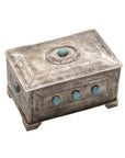 The J Alexander Rustic Silver 82-1-T 9 Stone Turq Box is a rectangular silver box with engraved patterns and nine turquoise stones on the lid and sides, ideal as Southwestern decor while standing elegantly on four small feet.