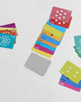 Artistic playing cards featuring numbers and stars, gray-backed, by Hachette Book Group for Bungalow Furniture.