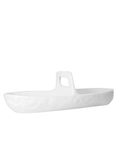 The 4774 Appetizer Platter NO. 774 by Montes Doggett is a white, elongated ceramic serving dish featuring a textured surface and a central vertical handle. Handmade using traditional techniques, this dish showcases a modern, minimalist design and is perfect for versatile trays to serve or display food items.