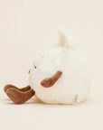 The Faire Dumpling Warmies is a round, fluffy white plush with brown arms and legs, a small tail, and embroidered face. This microwavable stuffed animal sits sideways on an off-white background and provides cozy comfort with its lavender scent.
