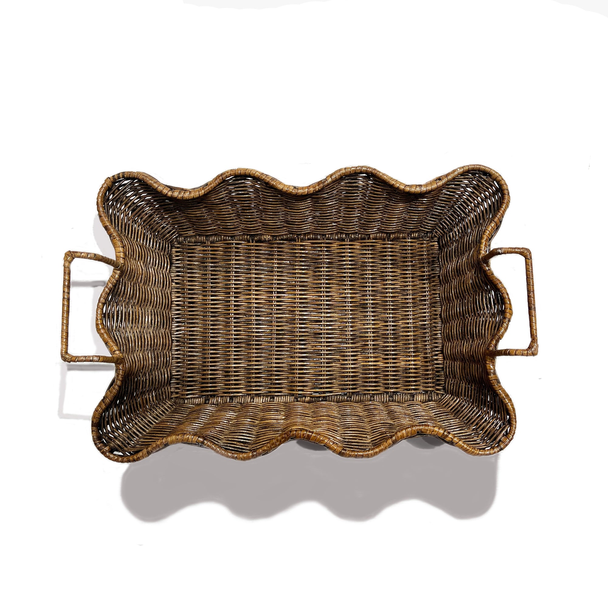 The Faire Small Scalloped Tray Brown, with wavy edges and dual handles, is shown from above on a white background—an elegant decorative accent for any room.