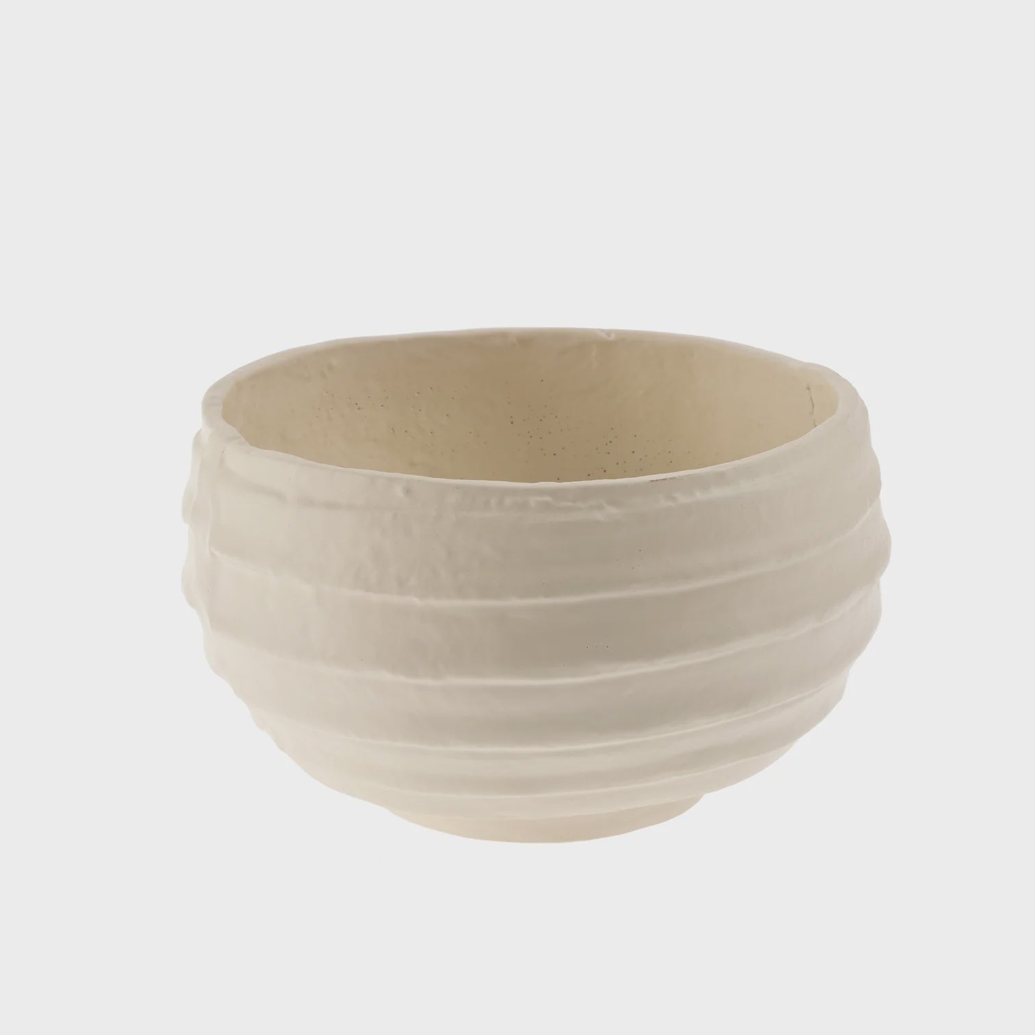 The Amos Decorative Bowl by Indaba, showcasing exquisite decorative artistry with its handcrafted white ceramic design and horizontal ridges on the exterior, is set against a plain background.