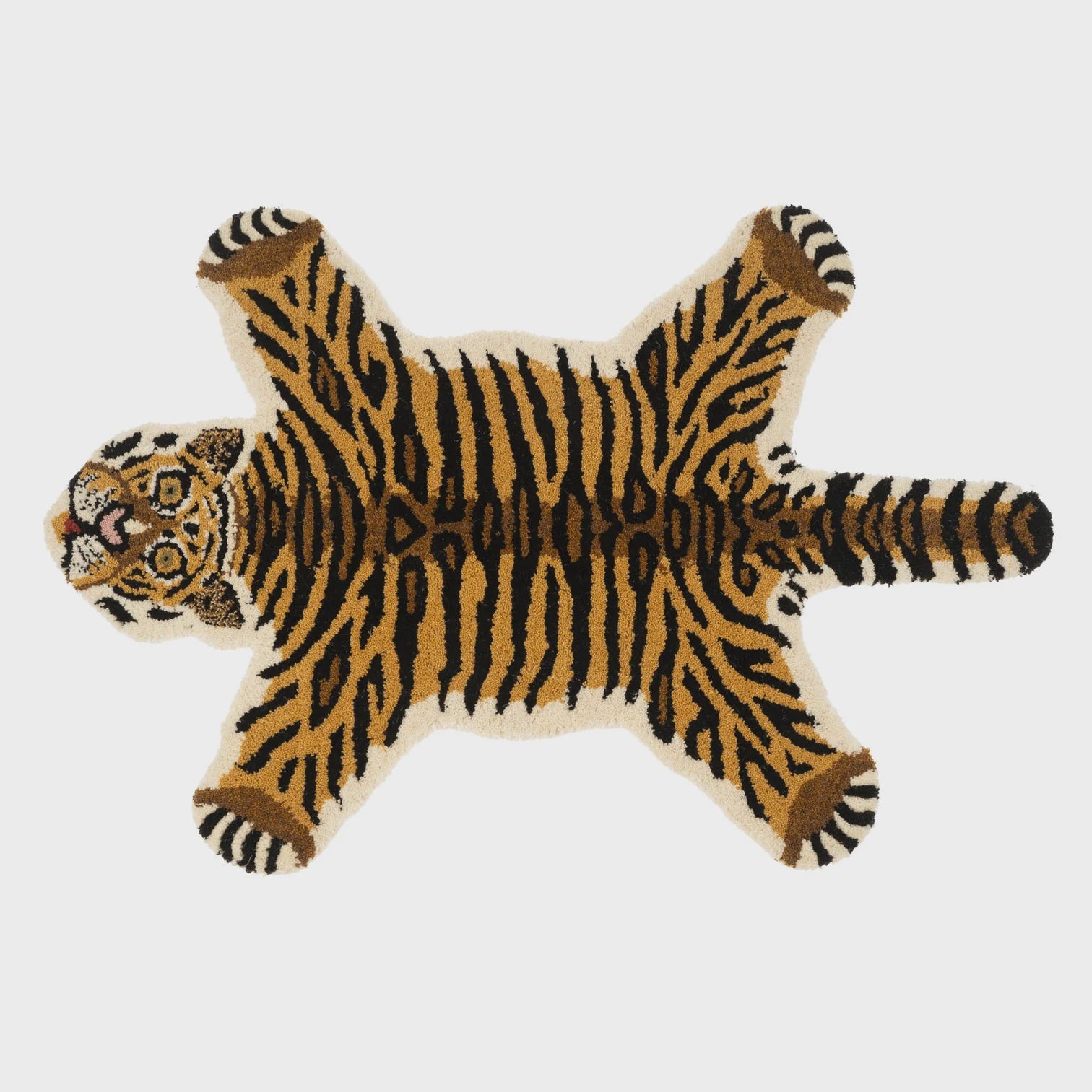 The Indaba Animal Mat, Tiger is designed as a decorative, soft, plush rug featuring an orange and black striped pattern in the shape of a tiger. It spreads out flat against any background, making it an ideal choice for adding a playful touch to a children's room.