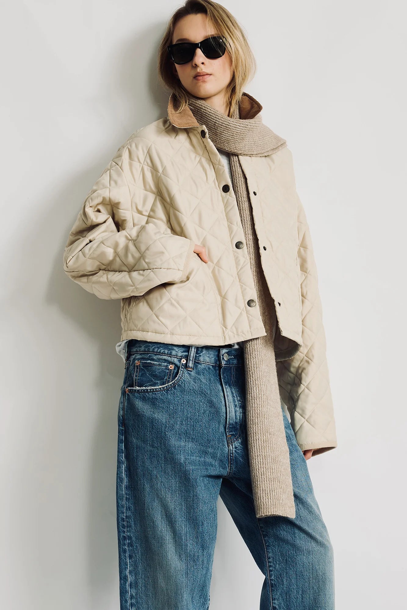 Denimist Faulkner quilted jacket with knit scarf, styled casually outdoors by a white wall.