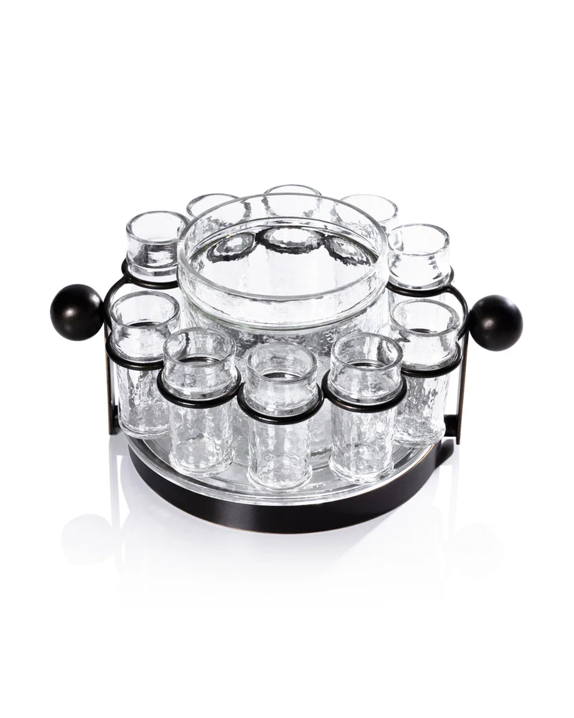 The Zodax IN-8239 Ten Shot Tequila Set w/Ice Bucket pairs perfectly with a clear glass server set featuring a central bowl and small jars, all on a round black metal rotating stand—ideal for serving condiments with your tequila.
