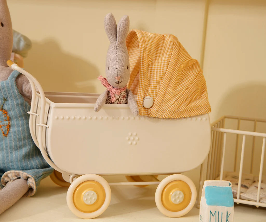 Maileg Micro Pram in yellow with tiny bunny wearing a pink scarf, styled with milk carton. Bungalow Furniture &amp; Accessories.