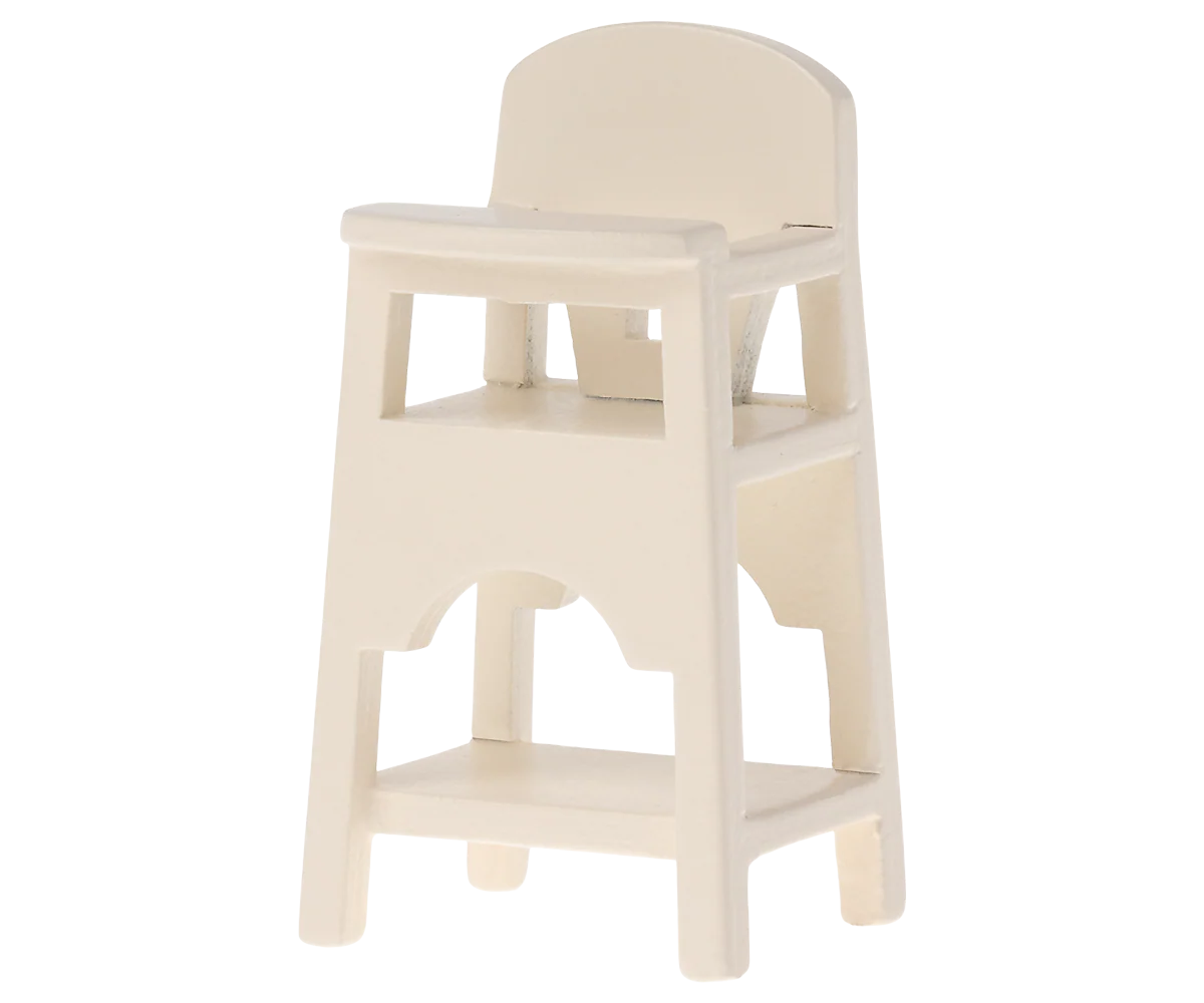 The Maileg Furniture high chair by Maileg is a cute, small, white plastic accessory with a simple design, backrest, armrests, and footrest—ideal for dollhouse play.