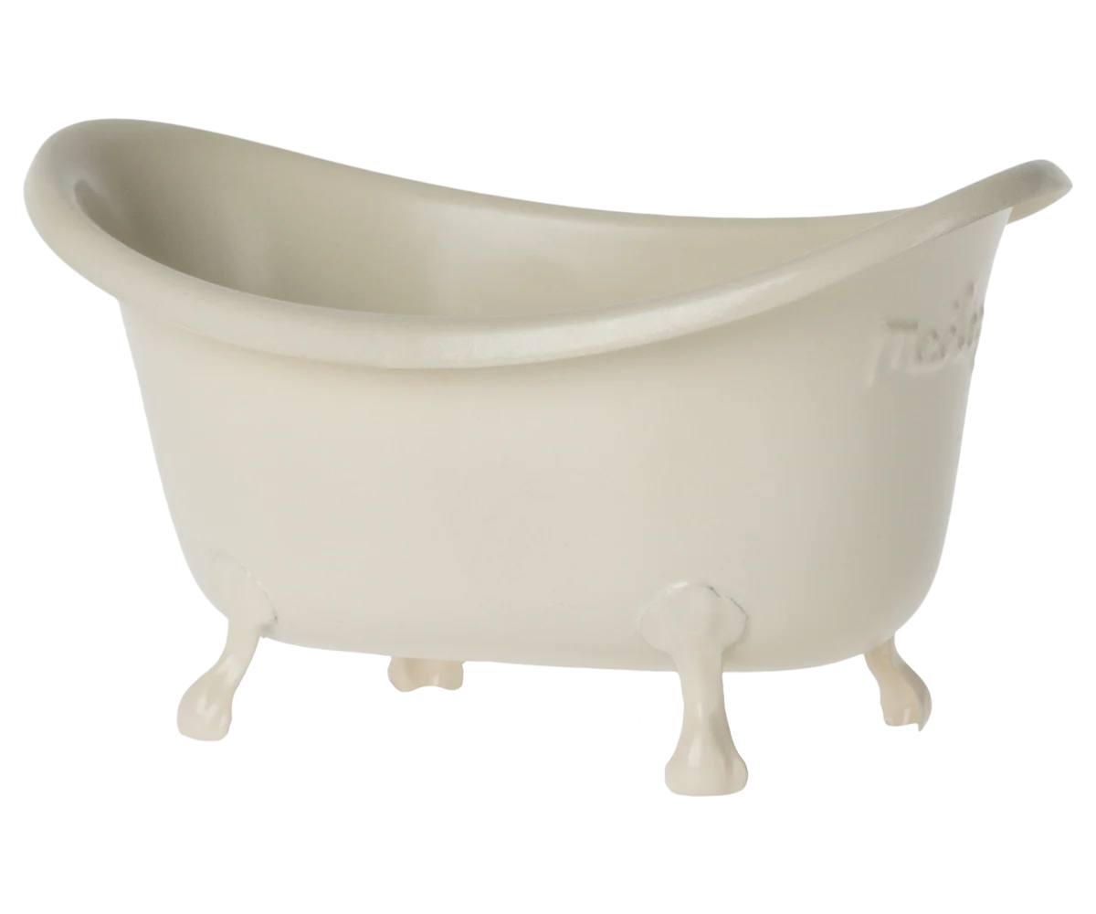 The Maileg Furniture by Maileg is an off-white, clawfoot bathtub with four legs and a curved rim, featuring a charming vintage design that&#39;s ideal for a Maileg Mouse dollhouse. Shown on a plain white background.