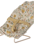 Floral fabric baby doll seat with yellow strap and metal frame, Maileg Micro Babysitter by Maileg.