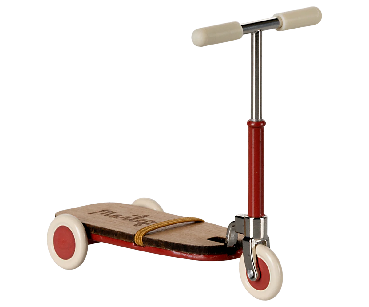 The Maileg Furniture vintage-style scooter by Maileg features a wooden deck, red frame, cream handlebar grips, and three white wheels—perfect for dollhouses or Maileg Mouse playrooms.