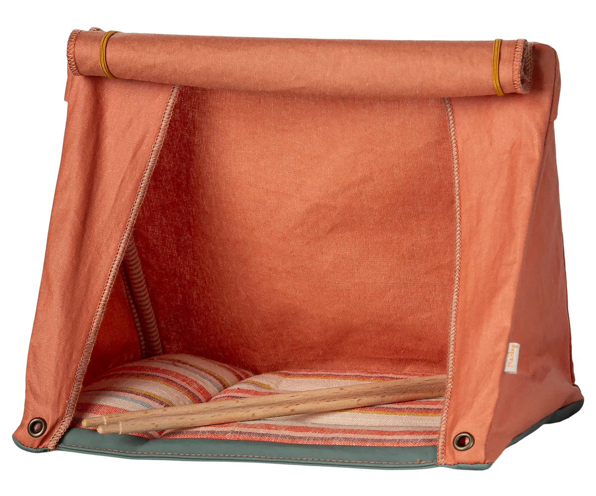 The Maileg Happy Camper Mouse Tent by Maileg is a small orange fabric tent with a roll-up front flap, striped cushion inside, and wooden poles—ideal for imaginative play and outdoor adventures on any flat surface.