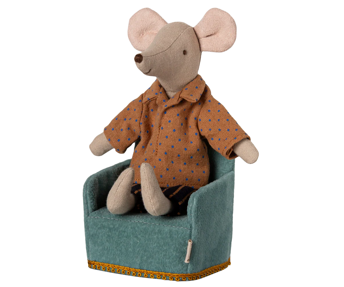 A small Maileg stuffed mouse with large ears, dressed in a brown shirt with blue dots and striped shorts, sits upright in a Maileg Folding Chair.
