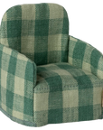 The Maileg Furniture armchair by Maileg features green and light beige plaid upholstery with rounded arms and backrest, ideal as dollhouse furniture or for a Maileg Mouse.