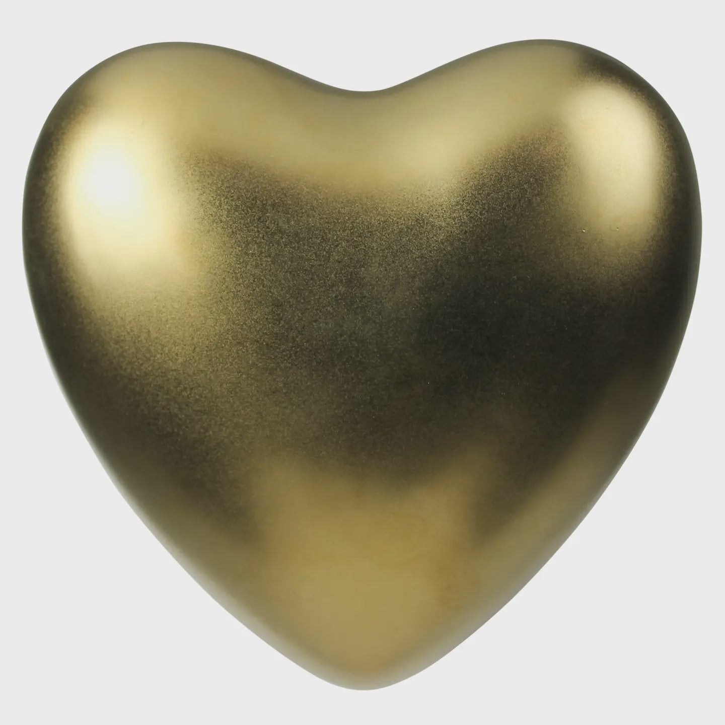 The Heart Ceramic Gold by HomArt is a smooth, golden, heart-shaped object with a metallic finish, perfect as wall decor on a plain white background.