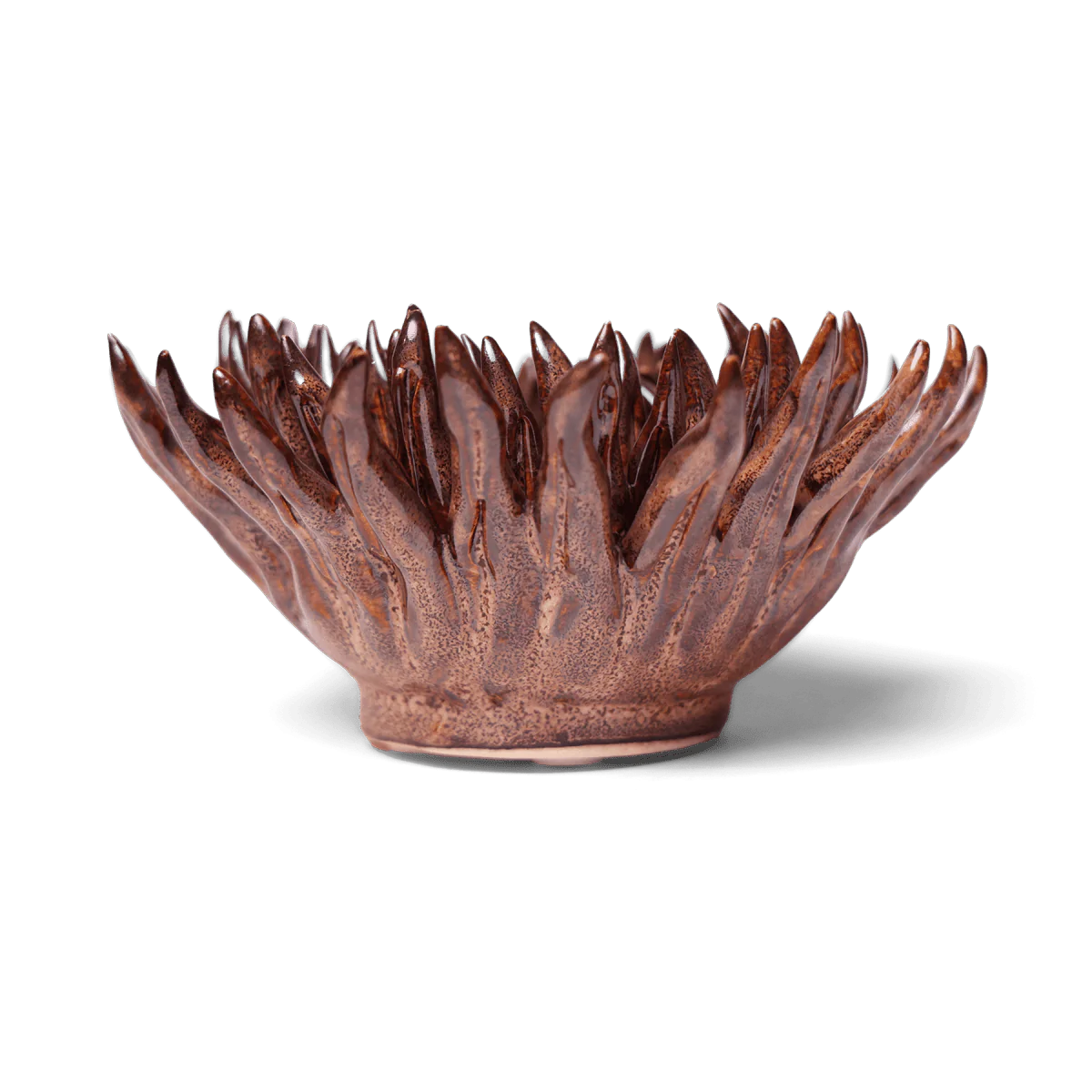 The Chocolate Mum by Chive Ceramics (thru Faire) is a glossy brown ceramic bowl with petal-like, flame-shaped edges that resemble a blooming flower—perfect as home décor and striking against light backgrounds.