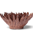 The Chocolate Mum by Chive Ceramics (thru Faire) is a glossy brown ceramic bowl with petal-like, flame-shaped edges that resemble a blooming flower—perfect as home décor and striking against light backgrounds.