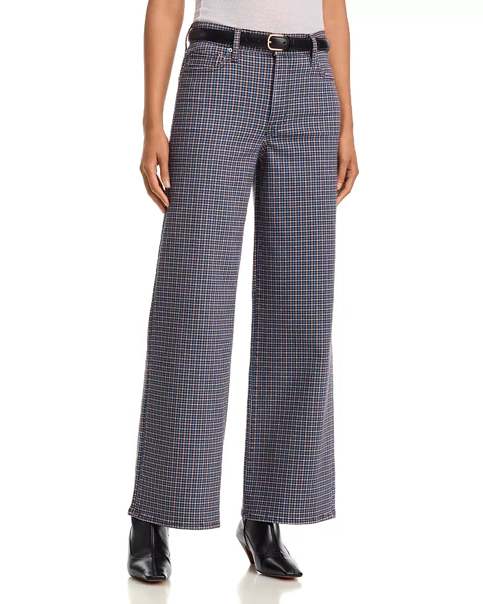 FRAME Le Slim Palazzo houndstooth pants with black belt and pointed boots, styled on white background.