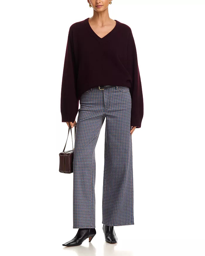 FRAME Le Slim Palazzo jeans with maroon V-neck sweater, styled with black boots and brown handbag.