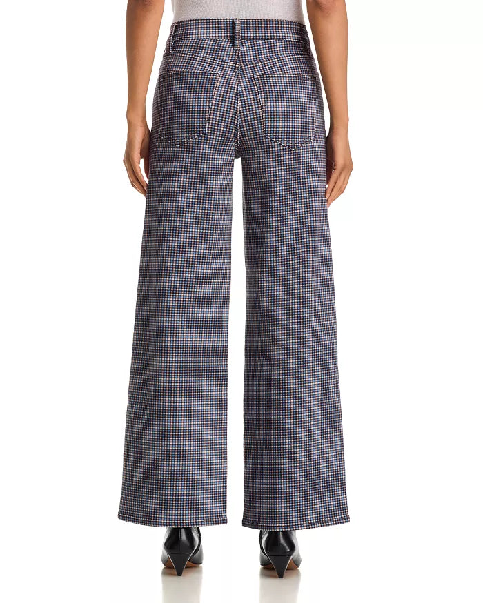 FRAME Le Slim Palazzo sustainable cotton pants in black, high-rise fit, shown from the back with pointed shoes.